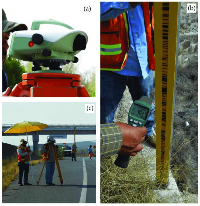 Máy thủy bình điện tử Leica và mia Invar đang được sử dụng để đo cao độ mốc quan trắc lún